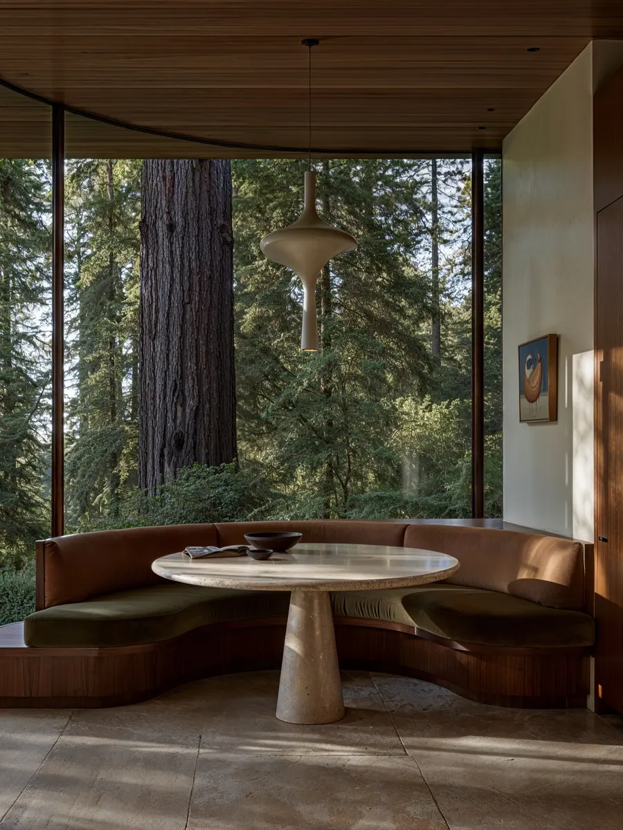 Forest House, dining nook with a round table facing the redwoods